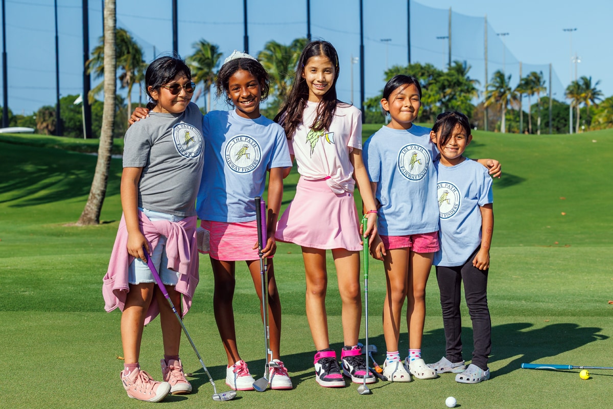 Kids in Fairway Finders t-shirts on golf course